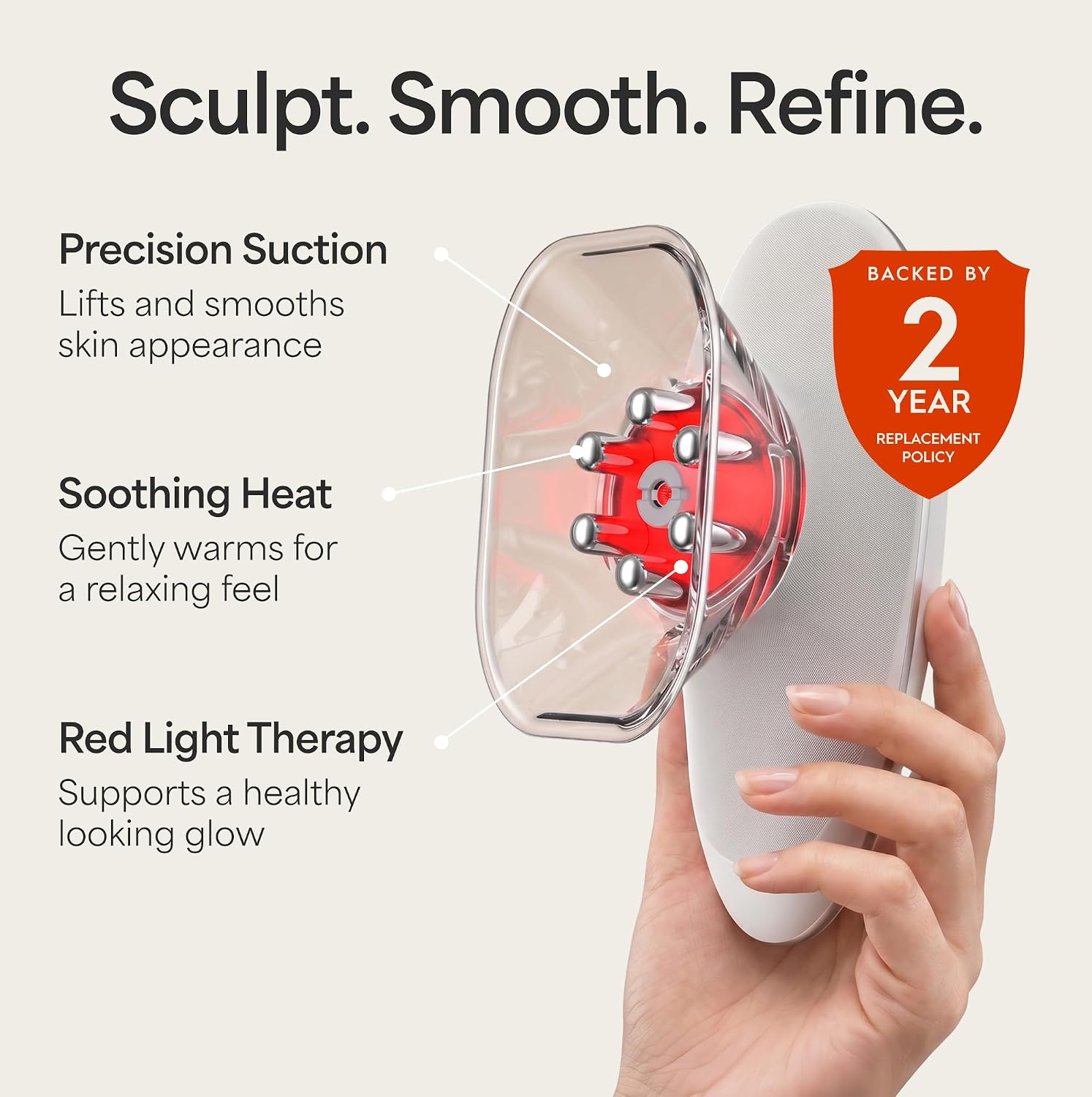 REVO Sculptor held in hand showing its suction cup, heat and red light head